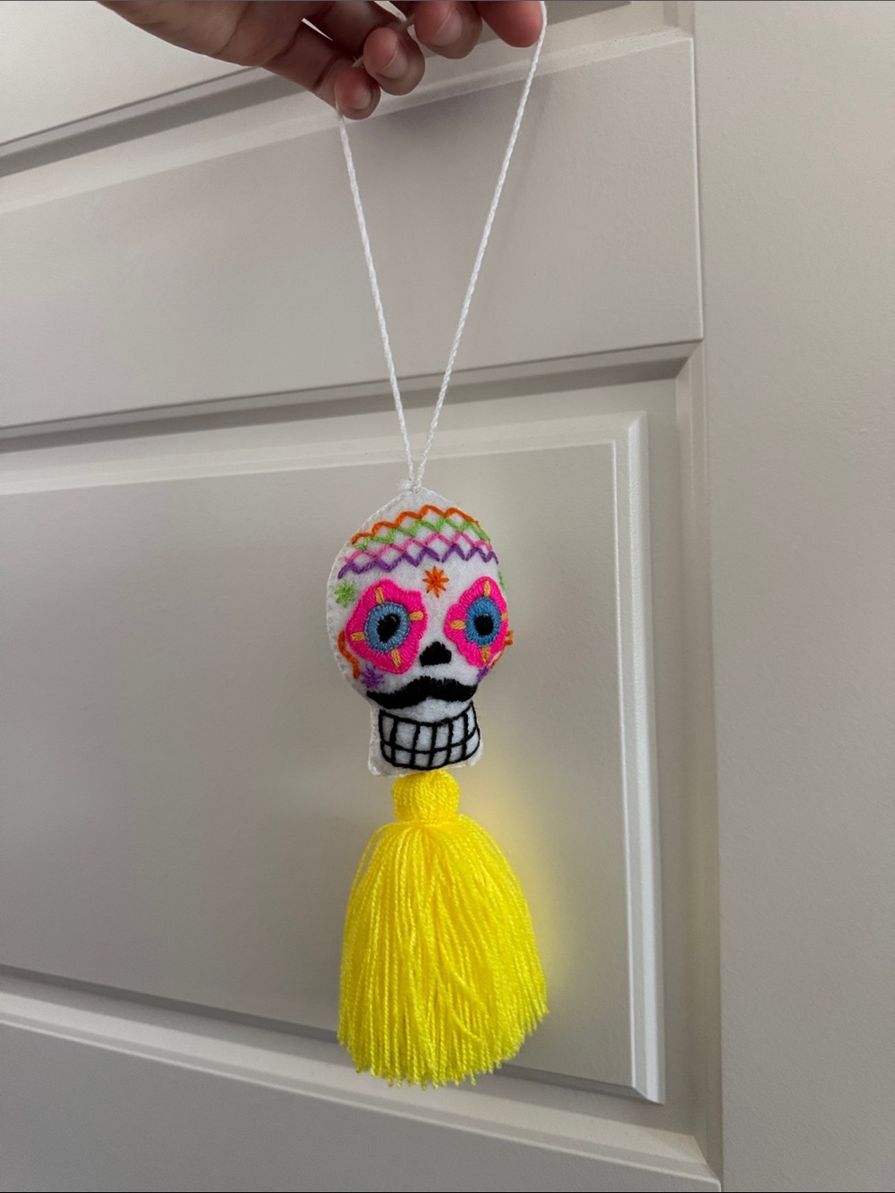 World Market Handmade Embroidered Sugar Skull Tassel - White & Neon Yellow